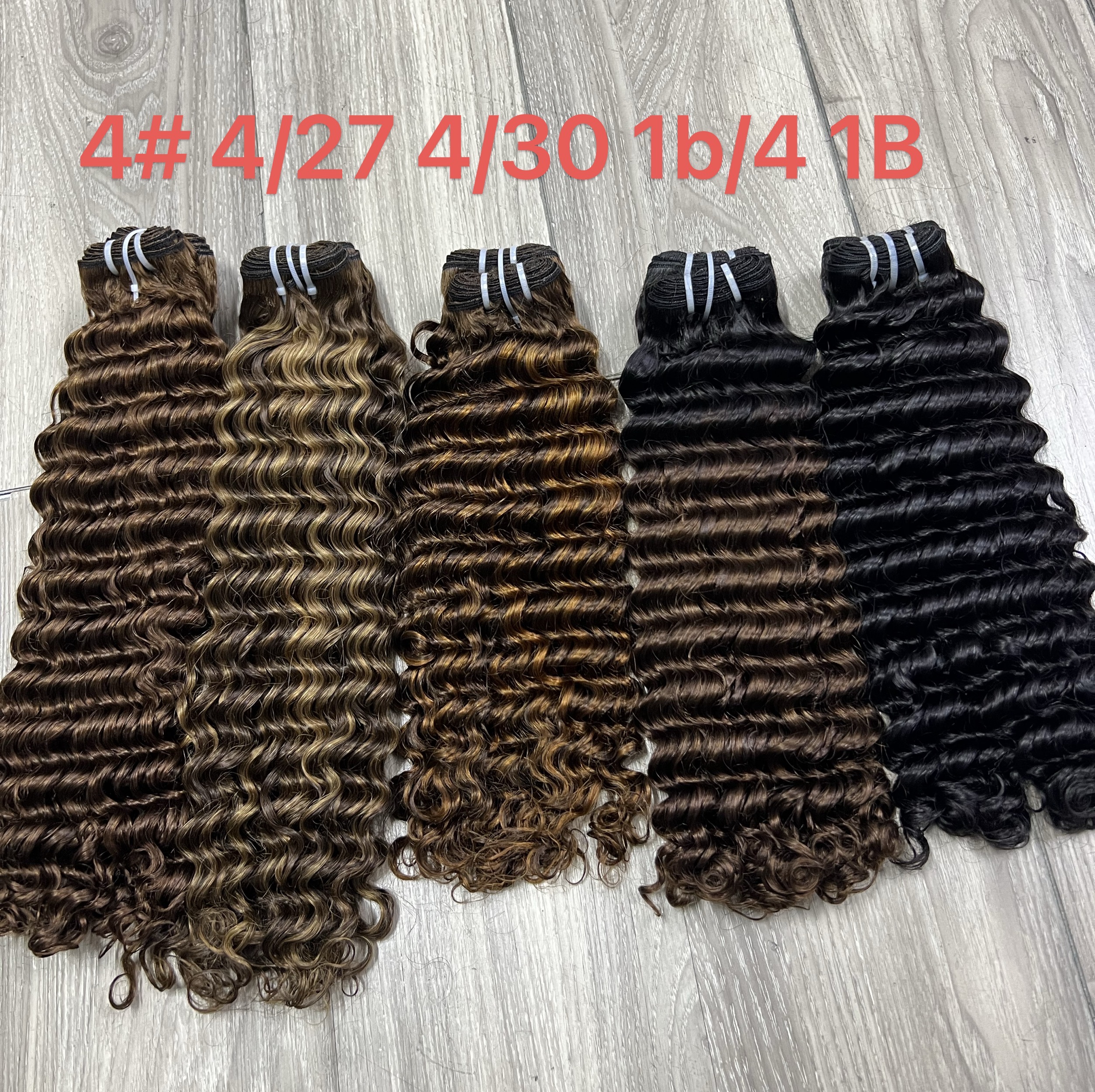 Close-up view of professional hair styling tools and premium products on marble counter, organized workspace